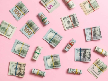 colored Background with money american hundred dollar bills on top wiev with copy space for your text in business concept.