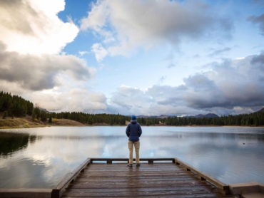 Man on mountains lake