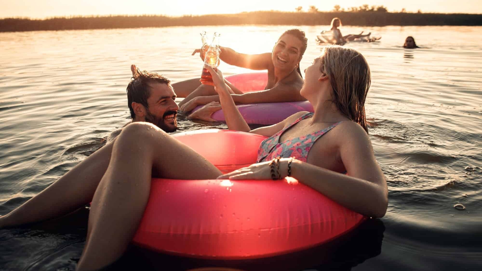 Friends enjoying a summer day swimming at the lake.