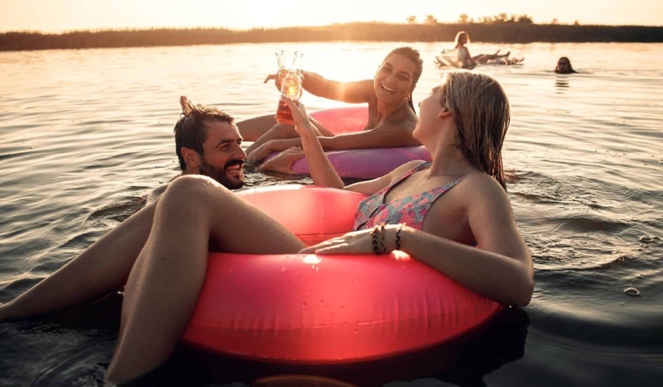 Friends enjoying a summer day swimming at the lake.