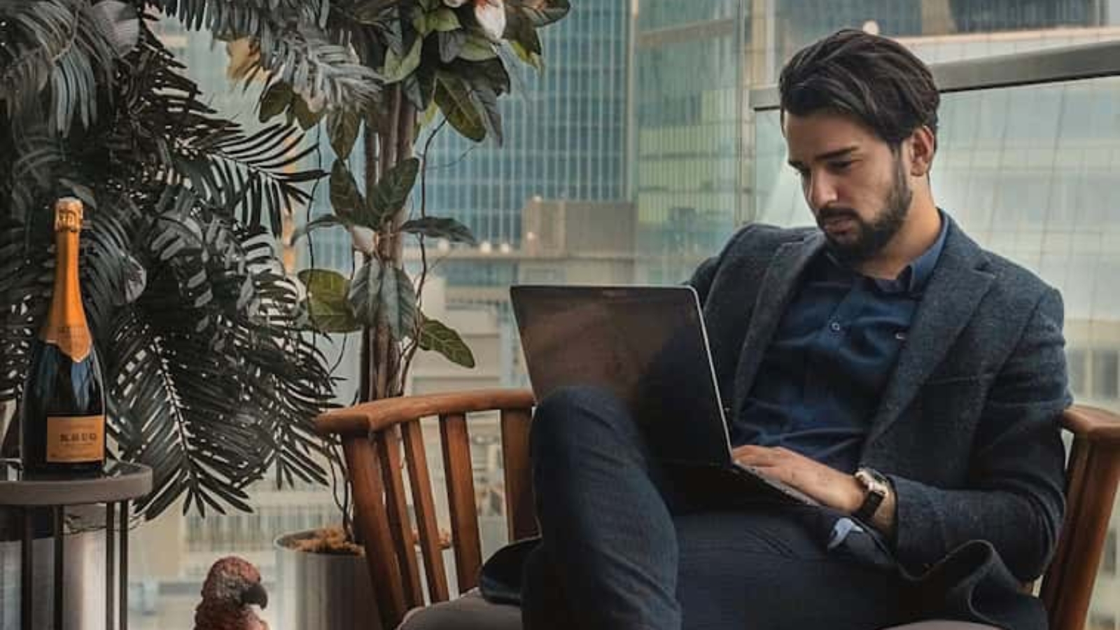 man sitting beside side table