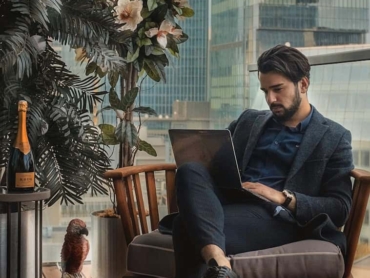 man sitting beside side table