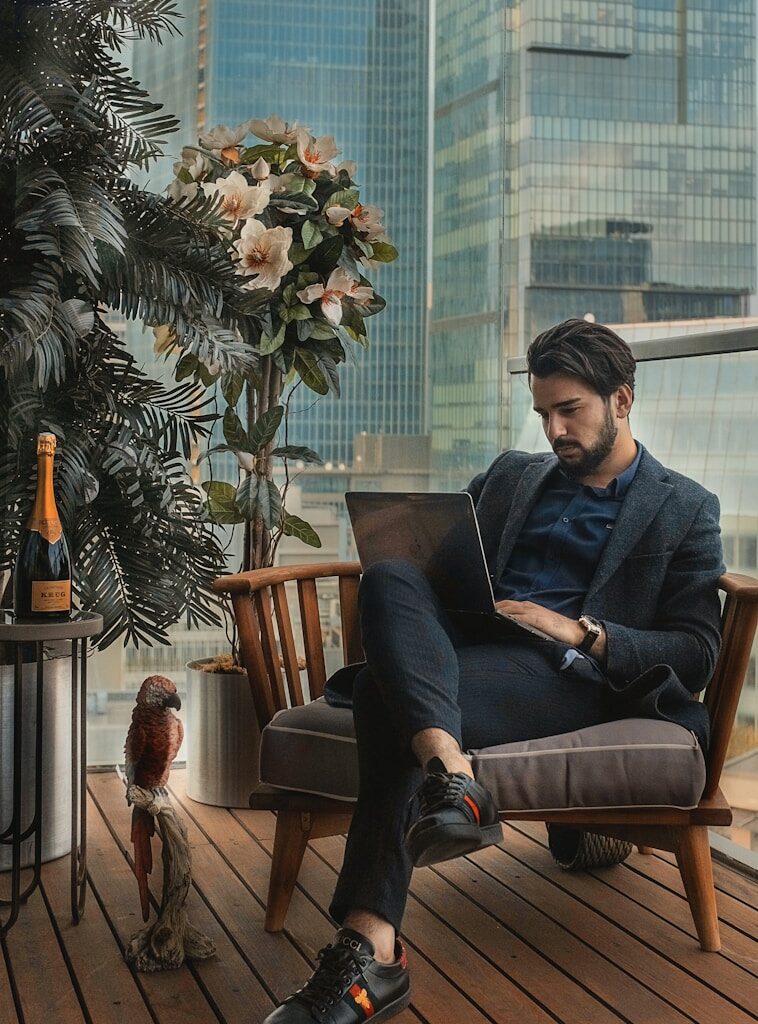 man sitting beside side table