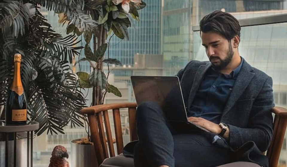 man sitting beside side table