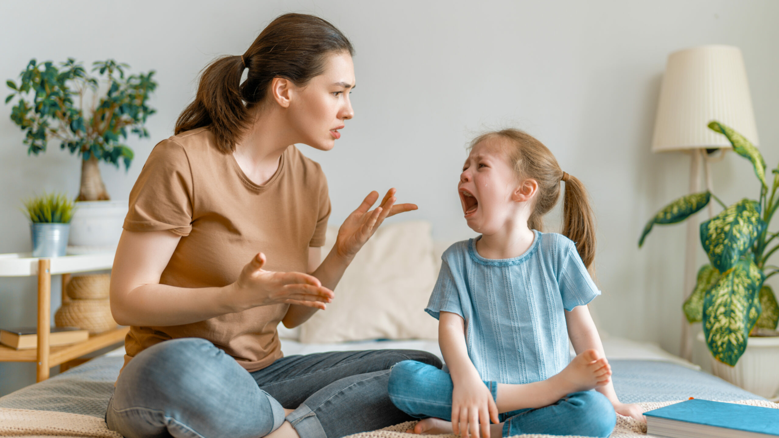 Mother is scolding her child girl, family relationships.