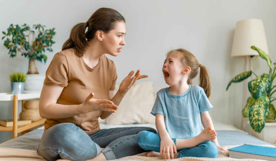Mother is scolding her child girl, family relationships.