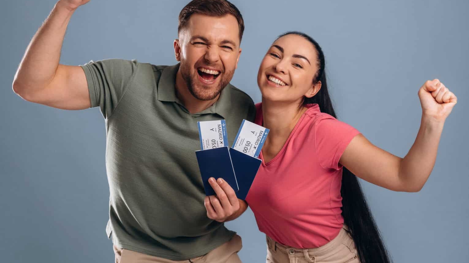 Very excited about vacation, with tickets. Man and woman are in the studio.